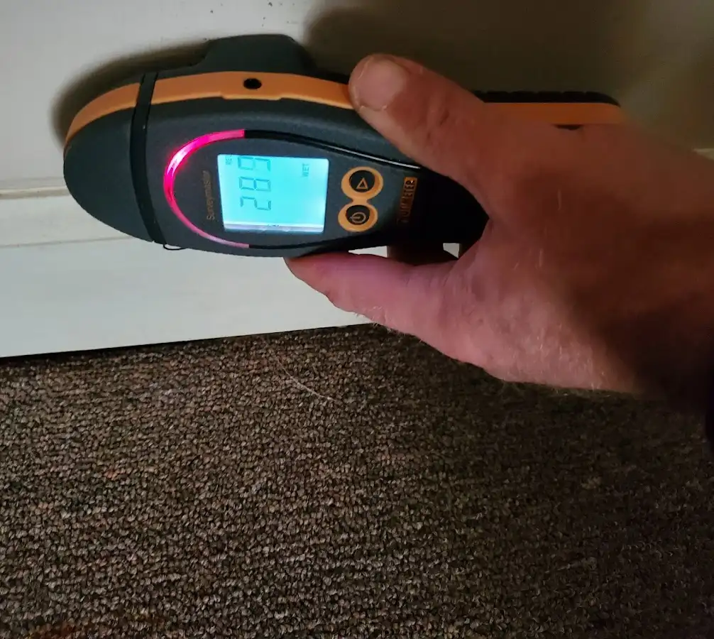Moisture detection at baseboard during Sewage Cleanup & Sanitation in Lower Salford